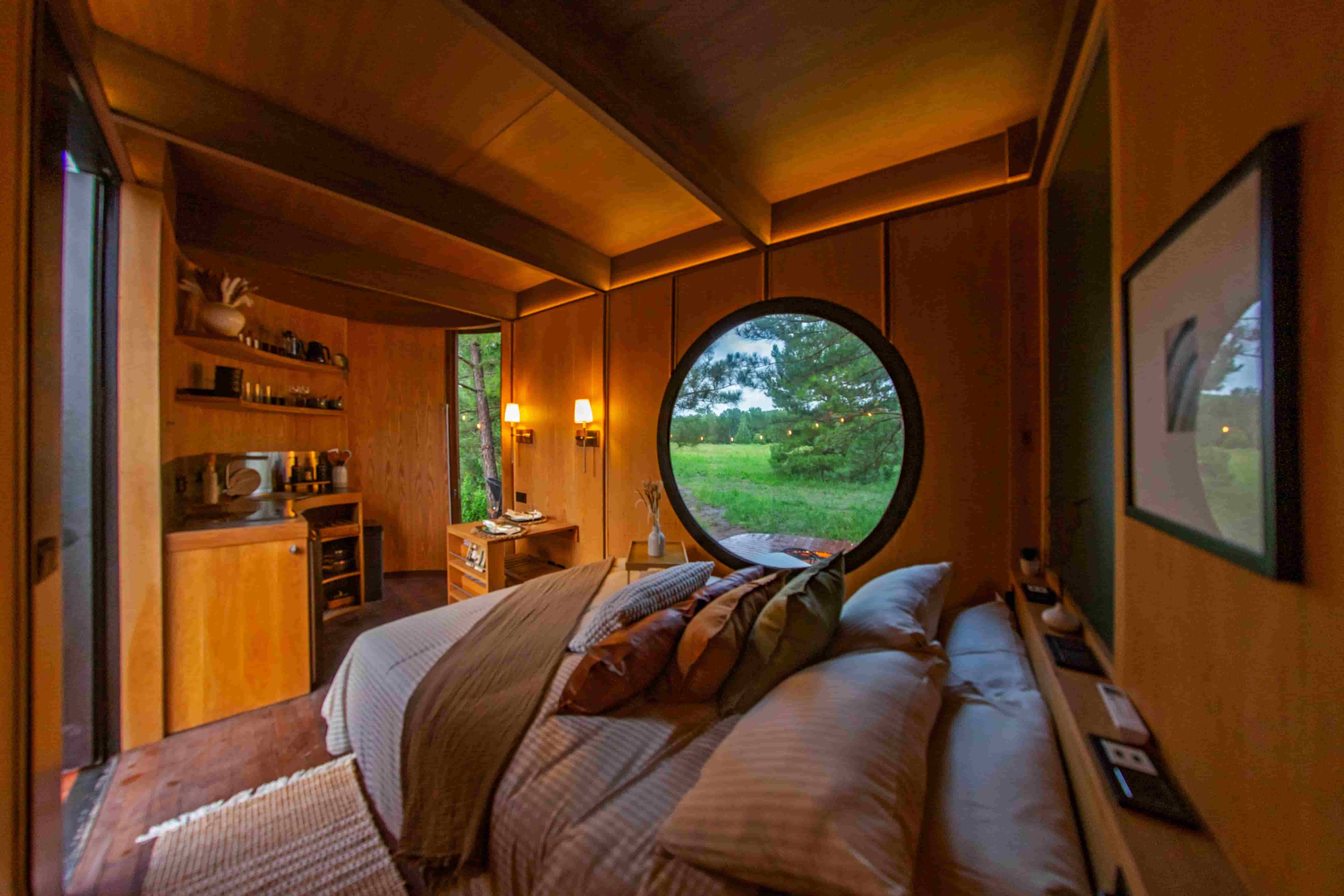 Warm wood interior and bed inside Cabin SOL