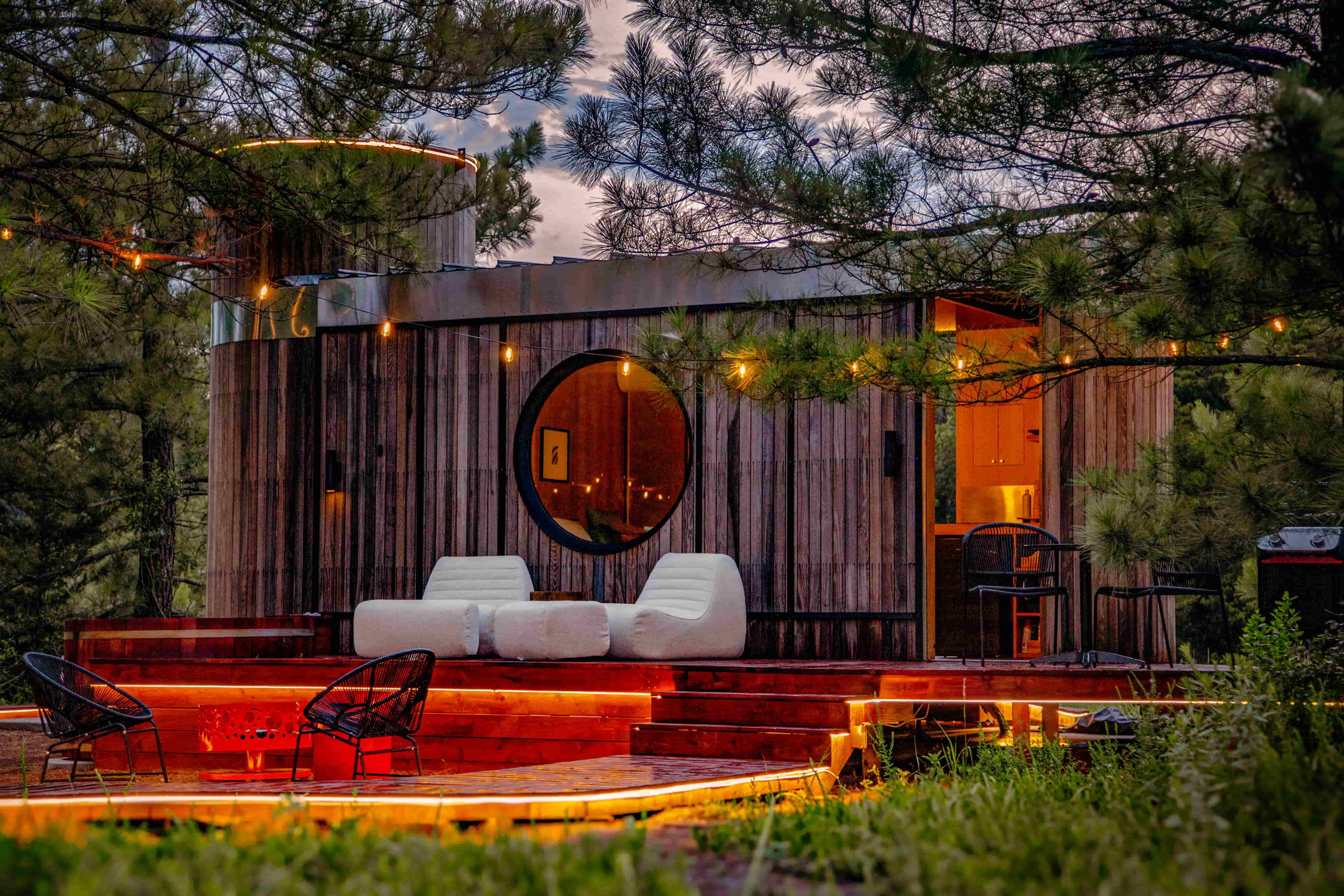 Cabin SOL glowing among the East Texas pines